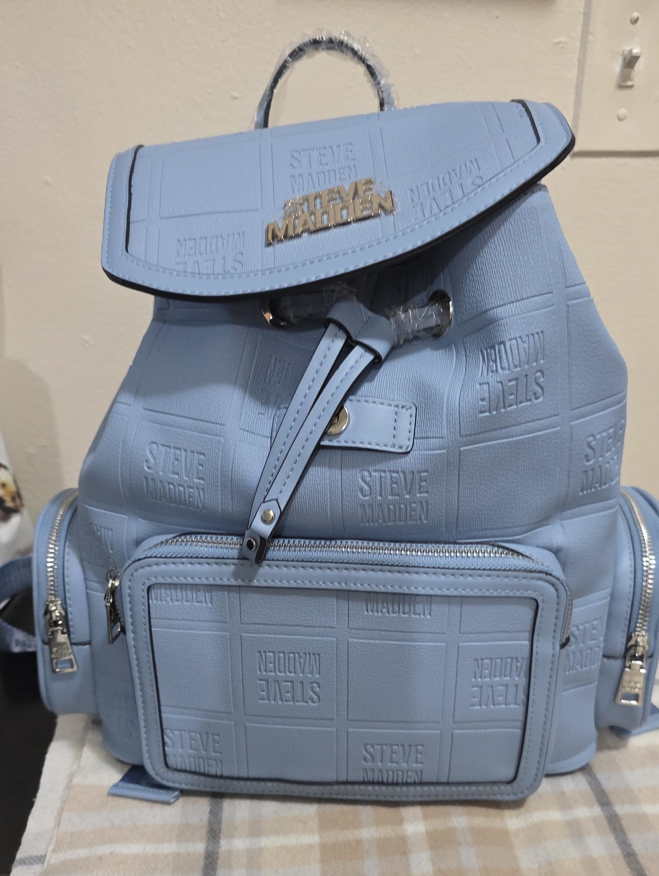 Steve Madden Pastel Blue Logo-Embossed Drawstring Backpack